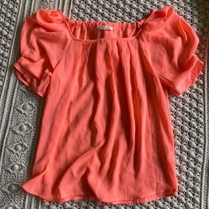 Neon coral ruffle top